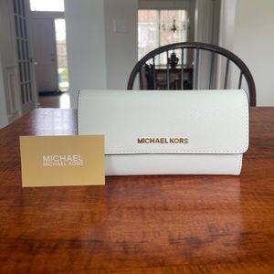 Used once! Michael Kors full sized wallet. Color white with gold hardware